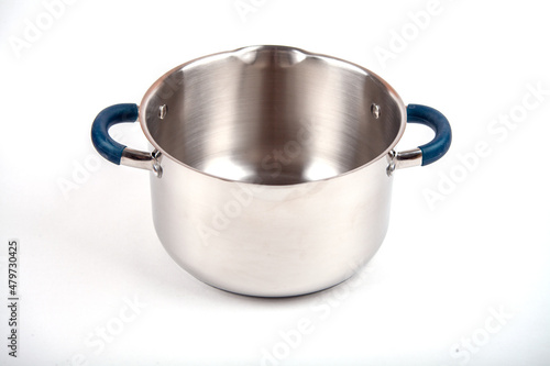 Metal saucepan with a glass lid for cooking soup, food. made of stainless steel. kitchen utensils with a thick bottom for electric, infrared, induction or gas stoves. On an isolated white background.