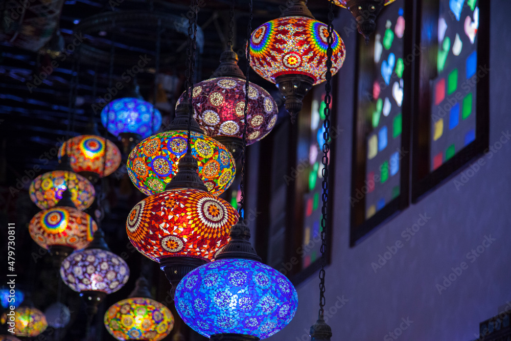 Doha,Qatar-May 05 2019: In the Old market Souk Waqif a decorative, traditional, glass mosaic lamps hanging. 
