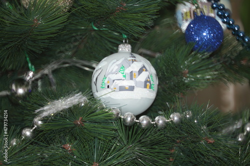 New Year's toys on a green Christmas tree. Christmas balls. beads. christmas new year concept.