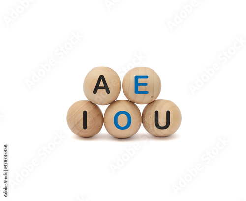 Wooden ball Vowels alphabet on white background