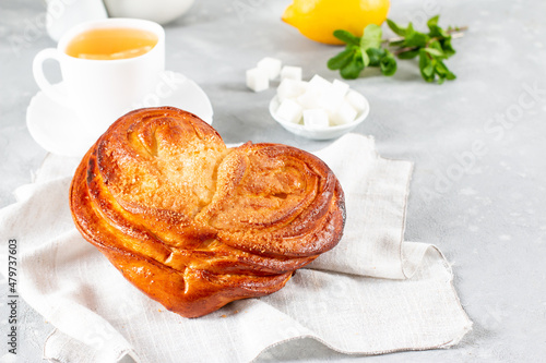 French buns with sugar. French pastry in palm leaf or butterfly shape. Homemade buns, plushka photo