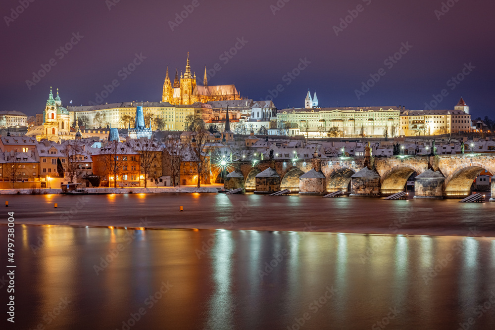 Obraz premium night, city, river, bridge, light, architecture, reflection, lights, europe, skyline, travel, cityscape, castle, town, evening, prague, urban, landscape, port, panorama, winter, snow, czech, sunset