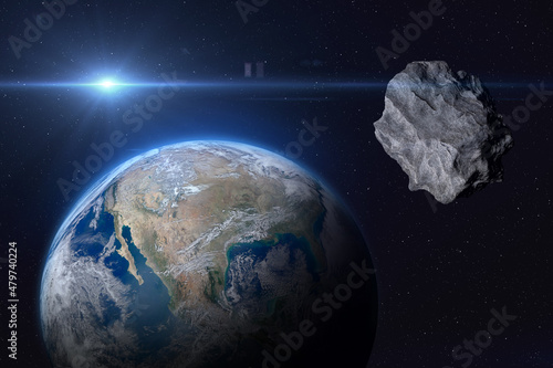 Fototapeta Naklejka Na Ścianę i Meble -  Planet Earth and asteroid. Elements of this image furnished by NASA.