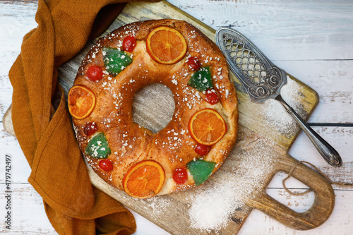 Roscón de reyes. Christmas typical spanish dessert on wooden background. Top view image photo