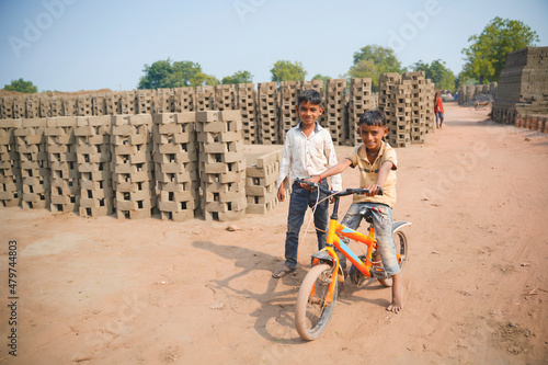 Indian labor's little child playing at brick factory.