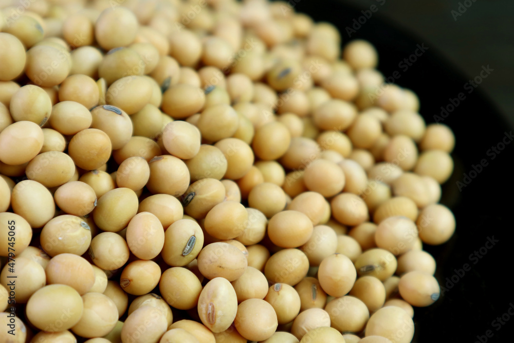 Closeup pile of dried soybeans on black background Closeup pile of dried soybeans on black background