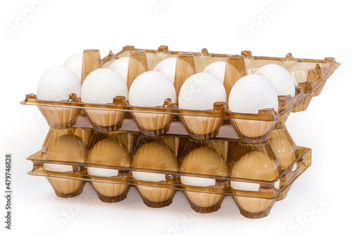 Chicken eggs in plastic egg packaging trays, side view