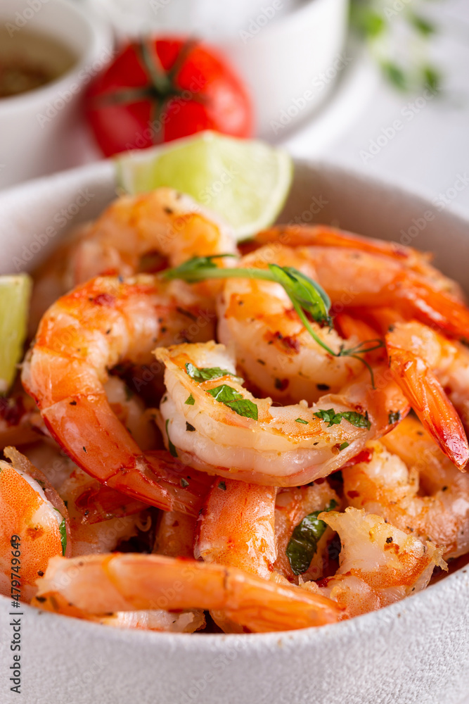Grilled shrimps in a white ceramic bowl Grilled shrimps in a white ceramic bowl