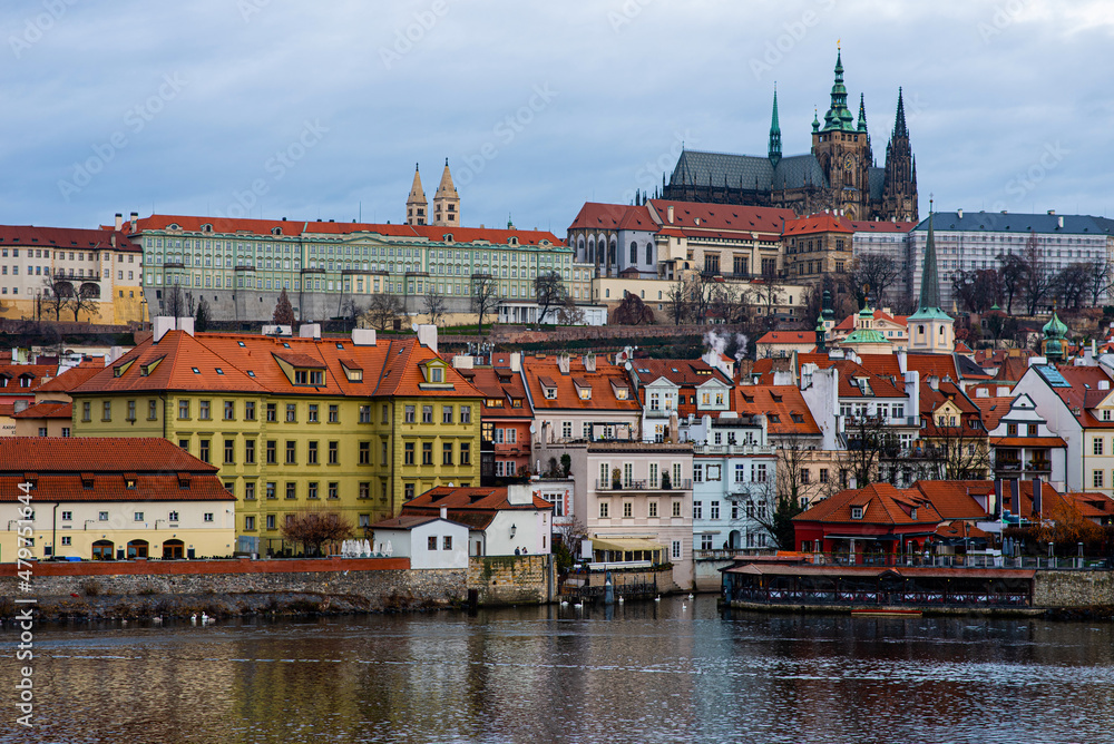 Scenic view of the architecture of the Old Town from Charles Bridge over the Vltava River in Prague, Czech Republic. Historic buildings on the banks of the Vltava River.