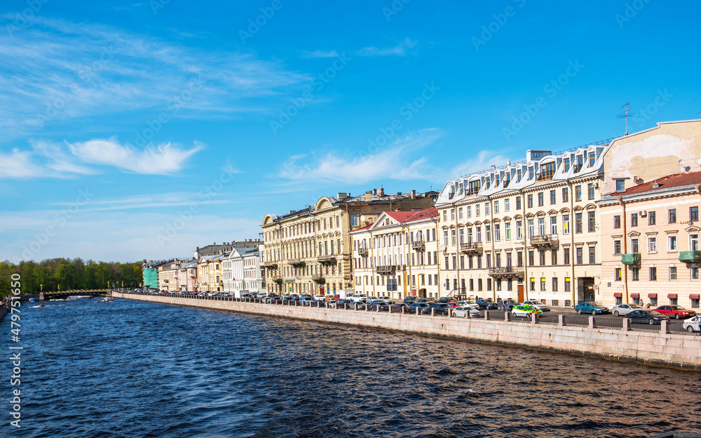 River channel with boats in Saint-Petersburg. Saint Petersburg panorama with canals, historic buildings and beautiful architecture. Russia. Spring time. Travel inspiration.