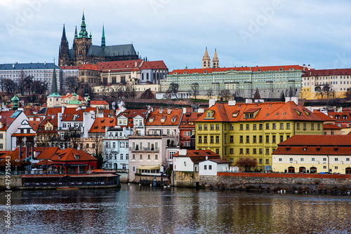 Scenic view of the architecture of the Old Town from Charles Bridge over the Vltava River in Prague, Czech Republic. Historic buildings on the banks of the Vltava River.