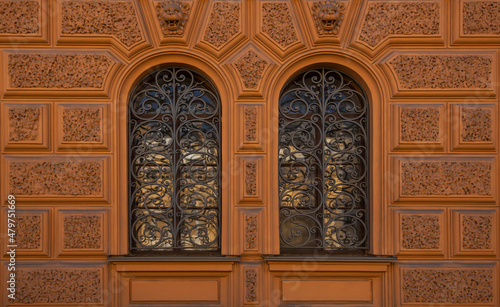 Vintage building facade wall. Rounded windows. Classic architecture historic buildings of St. Petersburg.