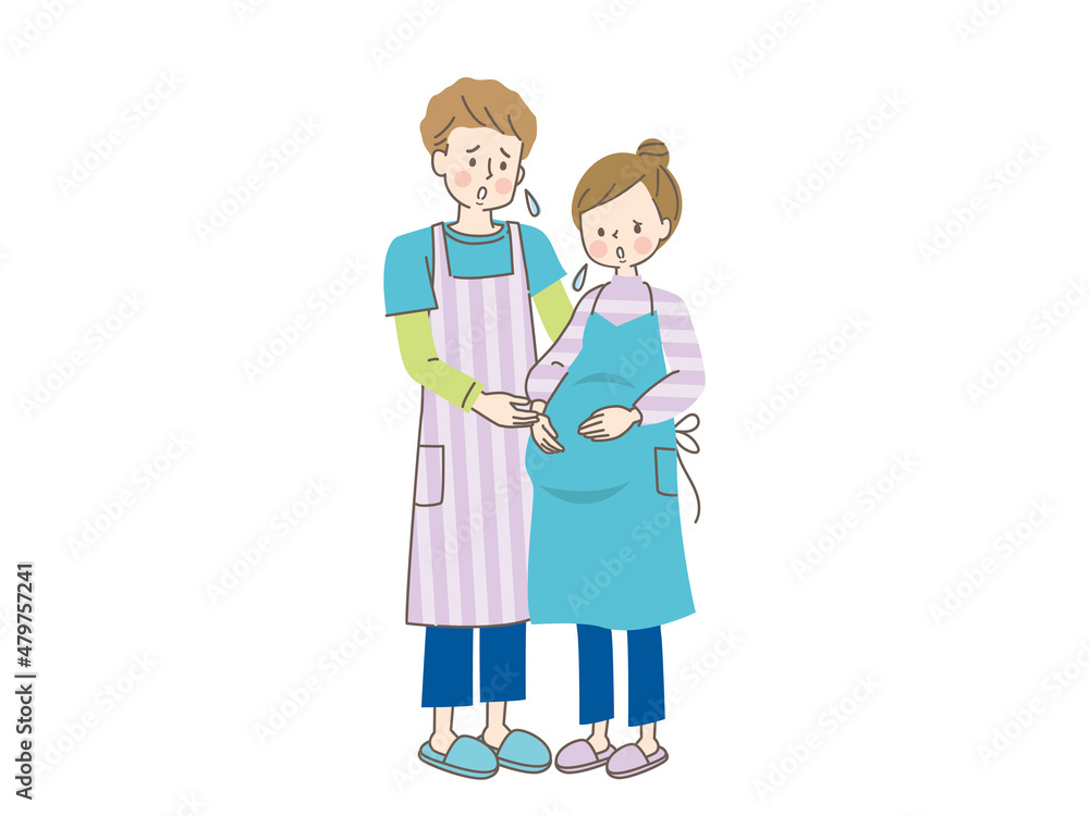 お腹の中の赤ちゃんを心配する妊婦と寄り添う夫