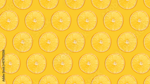 Orange slices pattern on yellow background