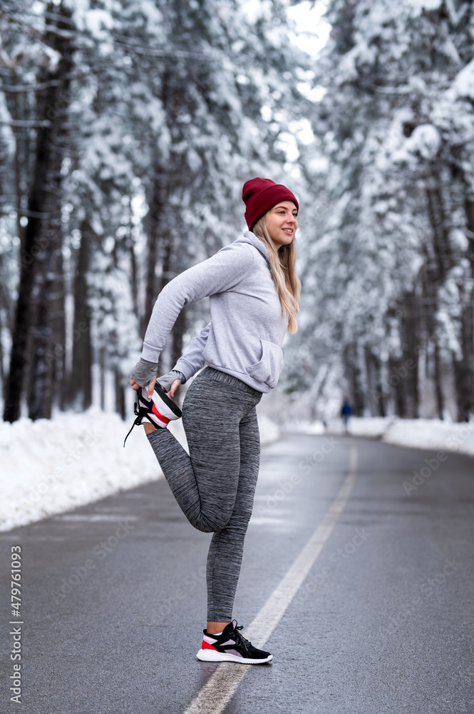 Fitness woman runner stretching legs before run. Healthy lifestyle. Change in life.