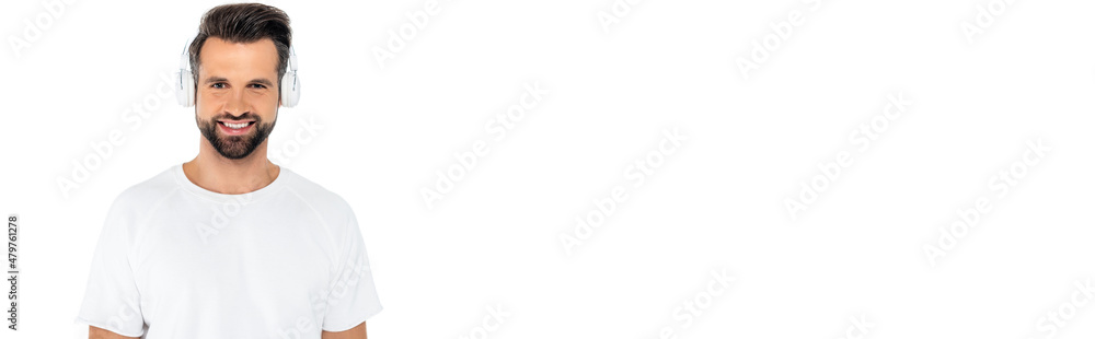 happy man in t-shirt and headphones looking at camera isolated on white, banner. happy man in t-shirt and headphones looking at camera isolated on white, banner.