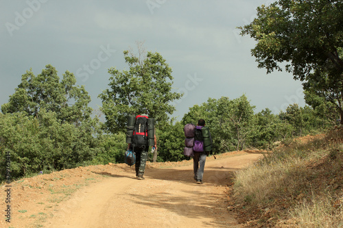 travelers hiking with camping gear © Kybele