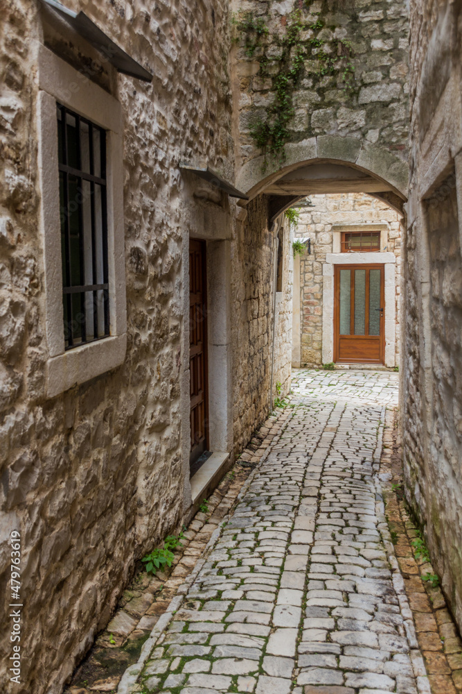 Narrow alley in the old town of Trogir, Croatia