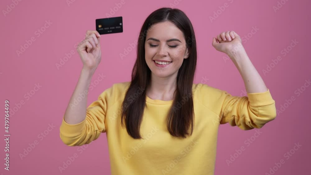 Lady rejoice credit card dance fist up isolated pastel color background Lady rejoice credit card dance fist up isolated pastel color background
