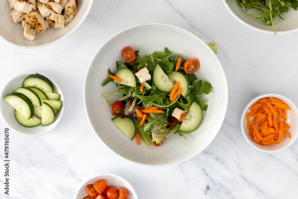 A Healthy Salad with Chicken, Tomatoes and Cucumbers A Healthy Salad with Chicken, Tomatoes and Cucumbers