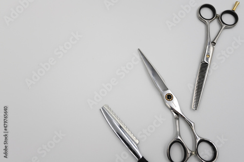 professional scissors and razor turn into a light background