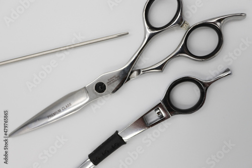 professional scissors and razor turn into a light background
