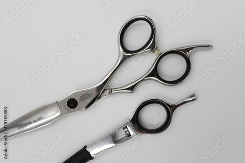 professional scissors and razor turn into a light background