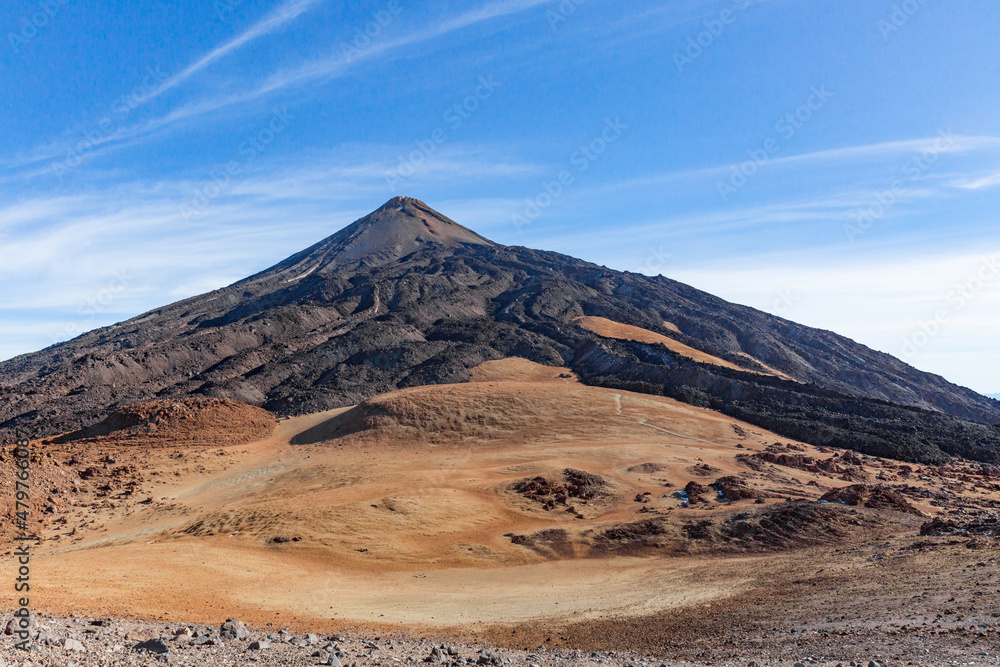 peak of Teide mountain on Tenerife and solidified lava fields