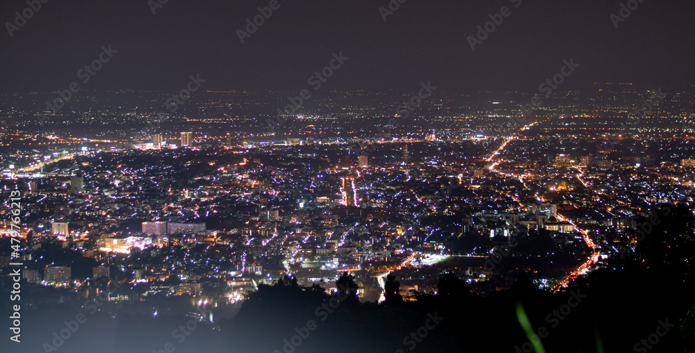 Obraz premium City night lights view from mountain of Chiang Mai Thailand with skyline.