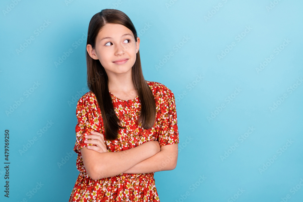 Photo of youth lovely girl curious look empty space folded hands isolated over blue color background Photo of youth lovely girl curious look empty space folded hands isolated over blue color background