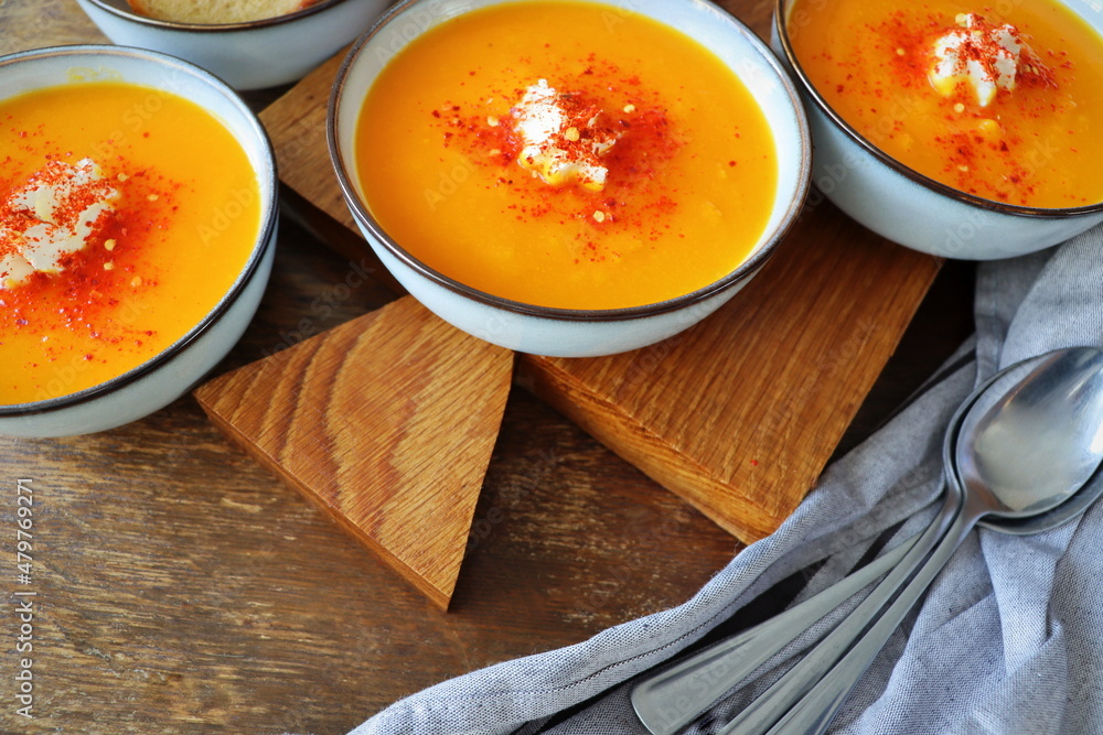 Thanksgiving concept with pumpkin soup .Fall table setting for celebration Autumn holiday with soup. Thanksgiving concept with pumpkin soup .Fall table setting for celebration Autumn holiday with soup.