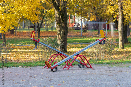 Foto Empty seesaw on playground in public park