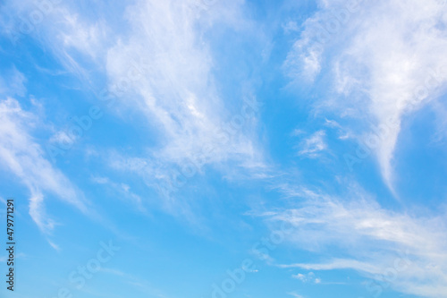 Blue sky with small white clouds for background usage.