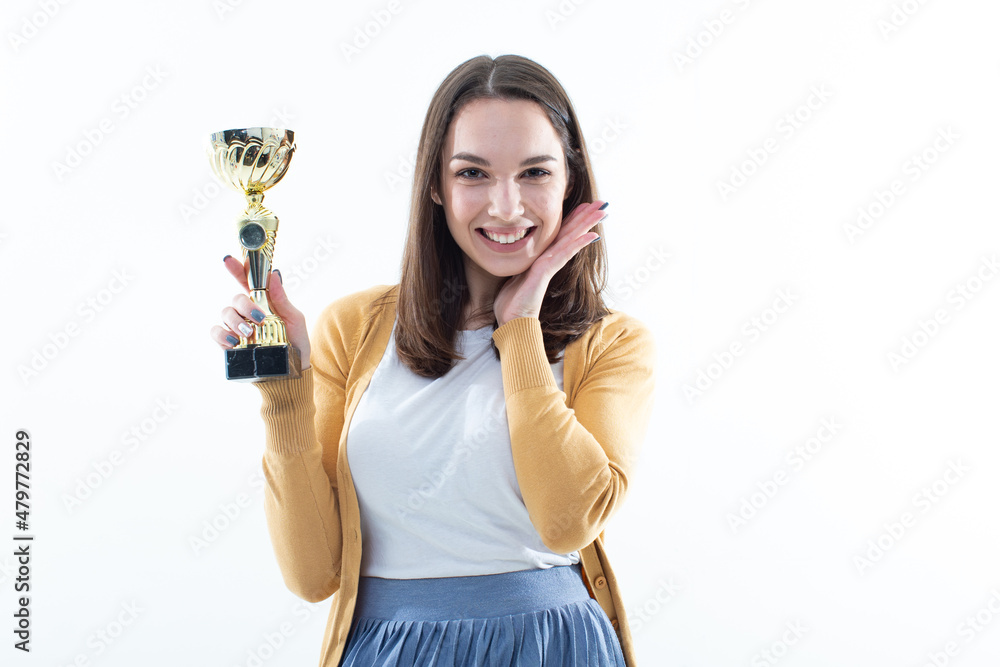 Girl with a winning cup. Emotional portrait Girl with a winning cup. Emotional portrait