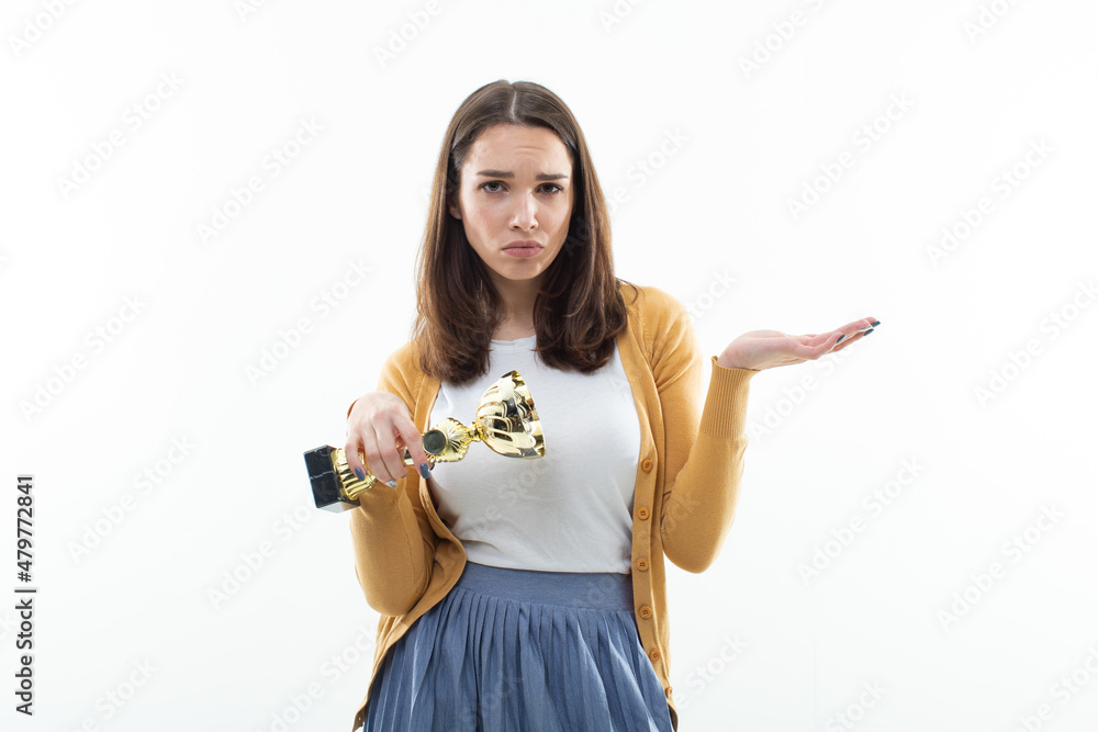 The girl is upset that she did not win the cup. Emotional portrait The girl is upset that she did not win the cup. Emotional portrait