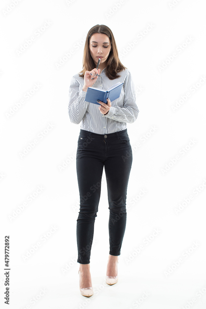 The girl in the striped shirt is surprised by what was written in the diary The girl in the striped shirt is surprised by what was written in the diary