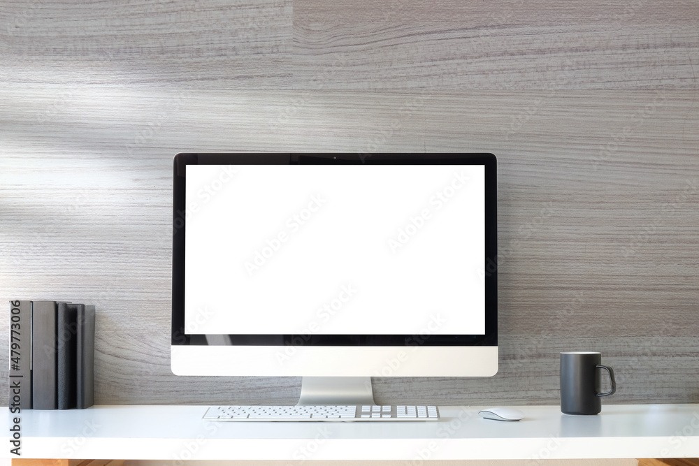 Minimal workplace with computer pc, coffee cup and book on white table. Blank screen for your advertising text. Minimal workplace with computer pc, coffee cup and book on white table. Blank screen for your advertising text.