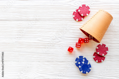 Fototapeta Naklejka Na Ścianę i Meble -  Red dices and gambling chips for poker. Casino games background