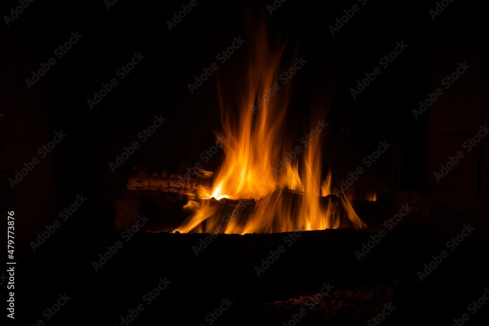 Beautiful wood fire in an old fireplace Beautiful wood fire in an old fireplace