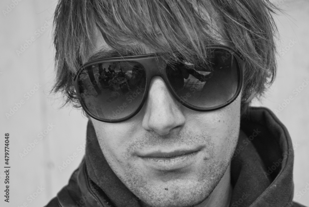 Black and white monochrome picture of a caucasian white man wearing sunglasses Black and white monochrome picture of a caucasian white man wearing sunglasses