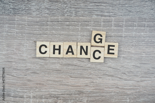 Chance and change wording on a wooden surface