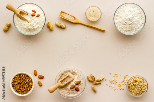 Various types of gluten free flour - almond peanut oat rice flour in bowls