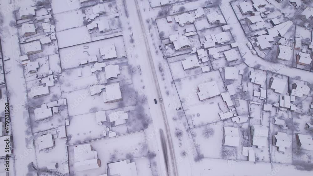 Aerial view of the ukrainian snow village with private houses and garden plots at winter time. Shooting from a drone. Ukraine, Eastern Europe Aerial view of the ukrainian snow village with private houses and garden plots at winter time. Shooting from a drone. Ukraine, Eastern Europe