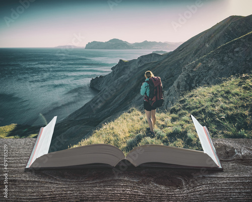 Girl hiker with backpack on the pages of an open book