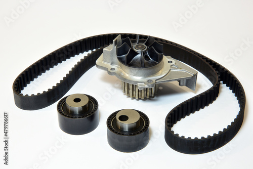 The timing belt, rollers and water pump stands on a white background photo