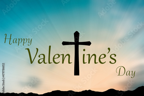 Happy Valentine's Day with Silhouette of Christian cross on blur sunset background
