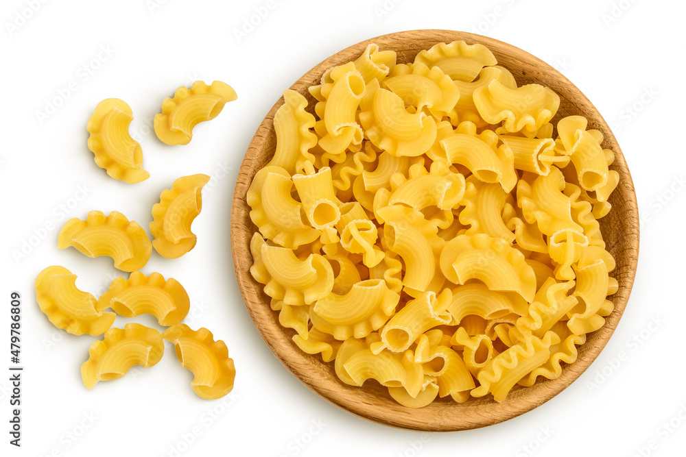 Pasta cornetti creste macaroni in wooden bowl isolated on white background with clipping path and full depth of field. Top view. Flat lay Pasta cornetti creste macaroni in wooden bowl isolated on white background with clipping path and full depth of field. Top view. Flat lay