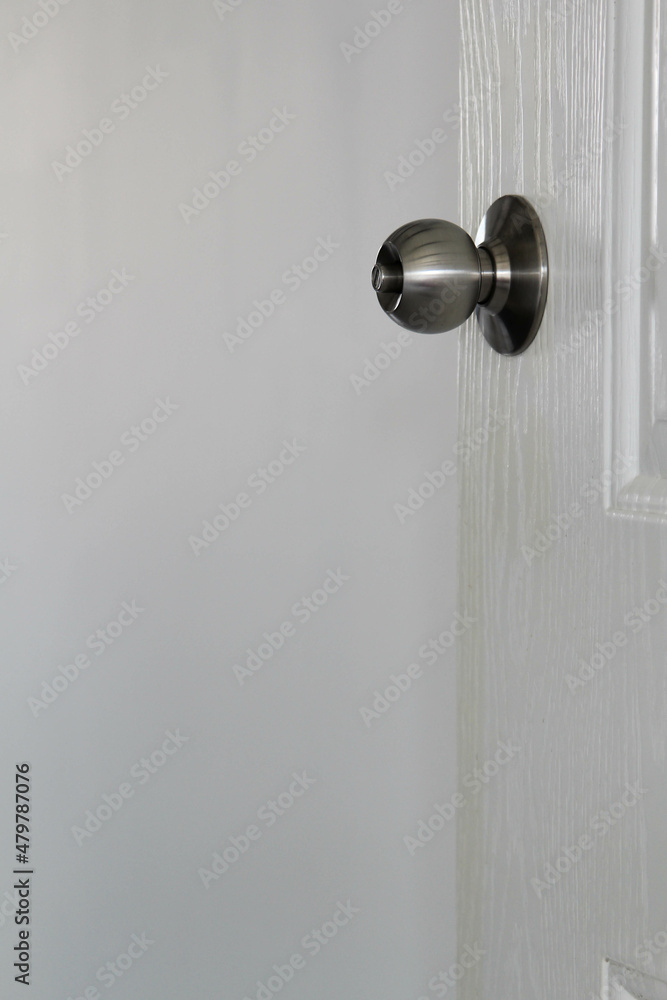 Door knob on white door and white wall background. Door knob on white door and white wall background.