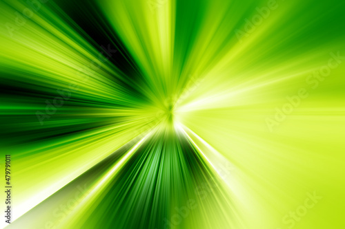 Abstract radial zoom blur surface in dark green and light green tones. Bright green background with radial, radiating, converging lines.