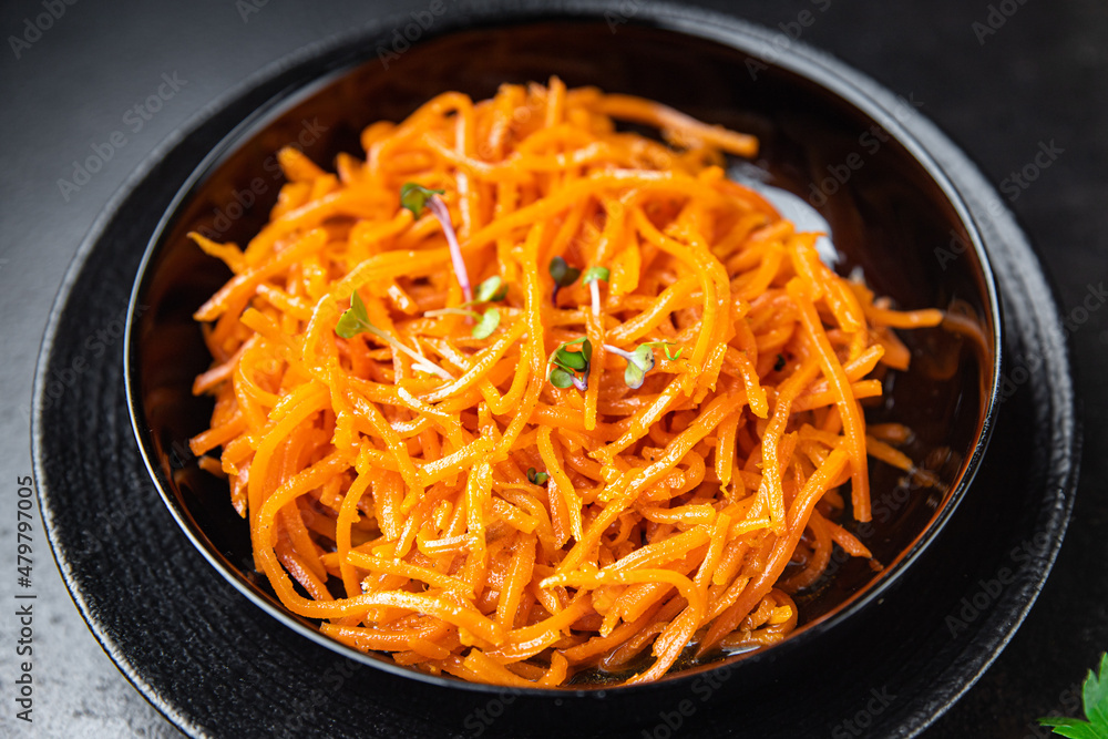 carrot salad fresh vegetable beta carotene spicy spices healthy meal food snack on the table copy space food background rustic top view carrot salad fresh vegetable beta carotene spicy spices healthy meal food snack on the table copy space food background rustic top view